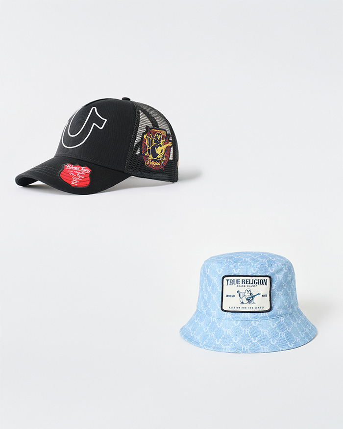 A black true religion trucker hat with horseshoe detailing and a baby blue bucket hat with buddha detailing