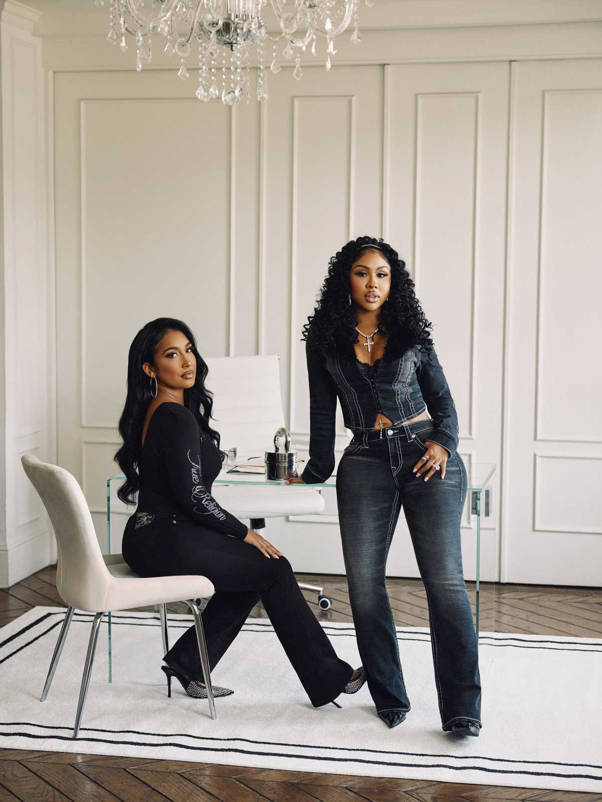 Woman wears true religion Baddie in the City collab camo velour sweat set and black heels against a city backdrop