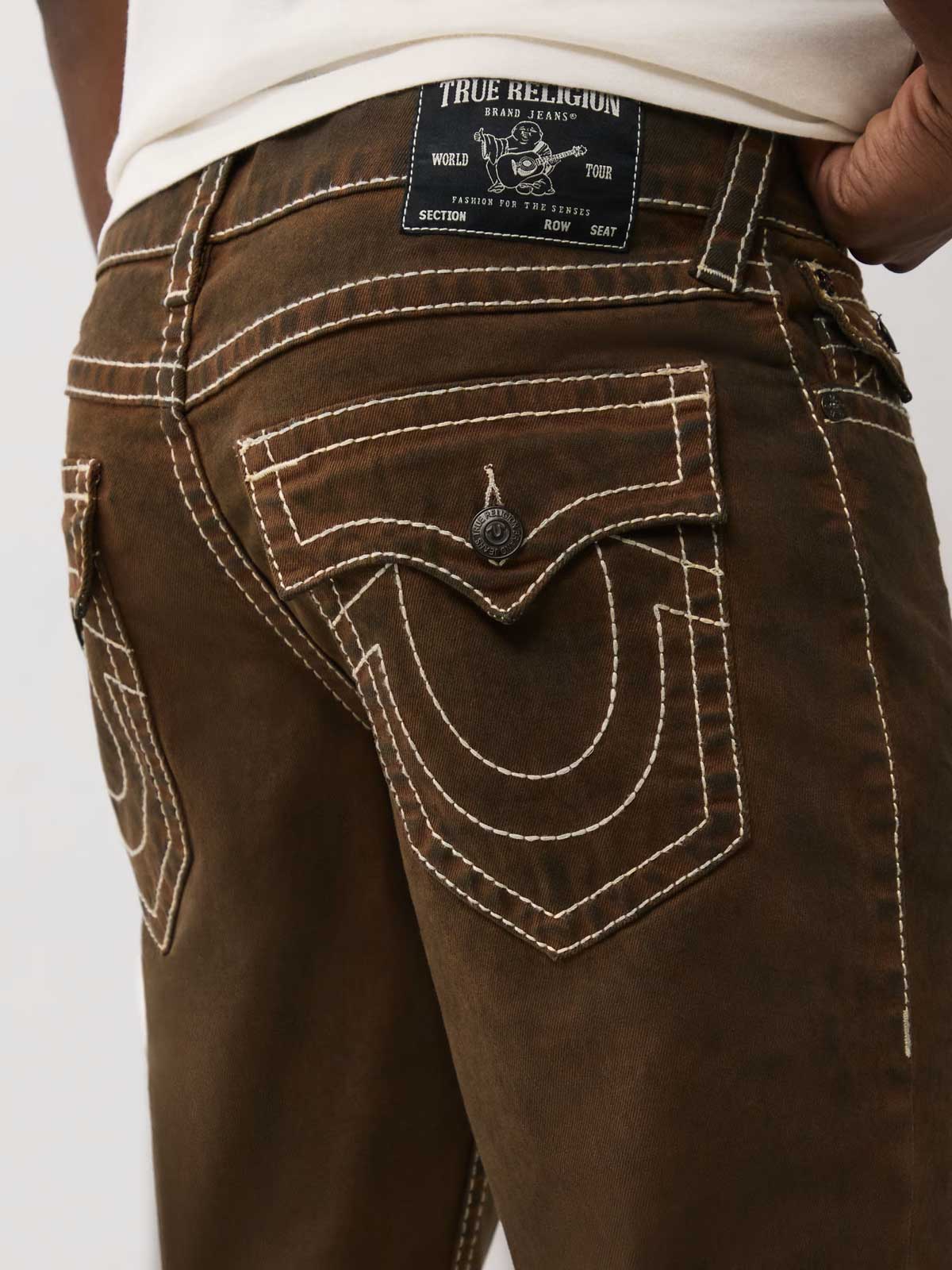 Close up of men’s true religion brown cargo pants with white stitching